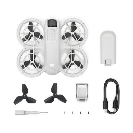 A birds eye view of the DJI Neo drone with batteries, charging cable and other acessories.